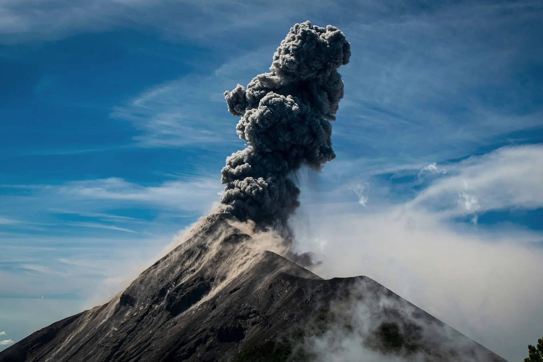 Volcanic eruption with a column of smoke
