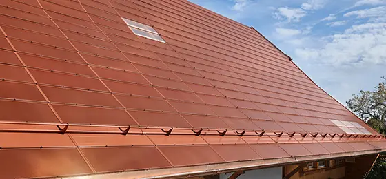 This photo shows the roof of a farmhouse with active terracotta tiles based on monocrystalline silicon cells.